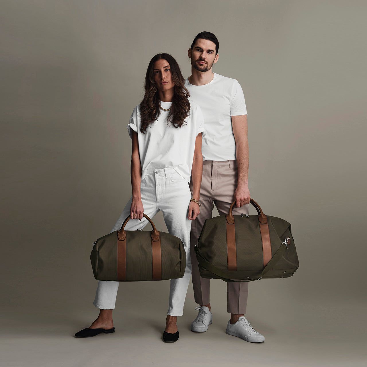 "Fashion model showcasing the versatile Weekender Bag, perfect for travel and style.