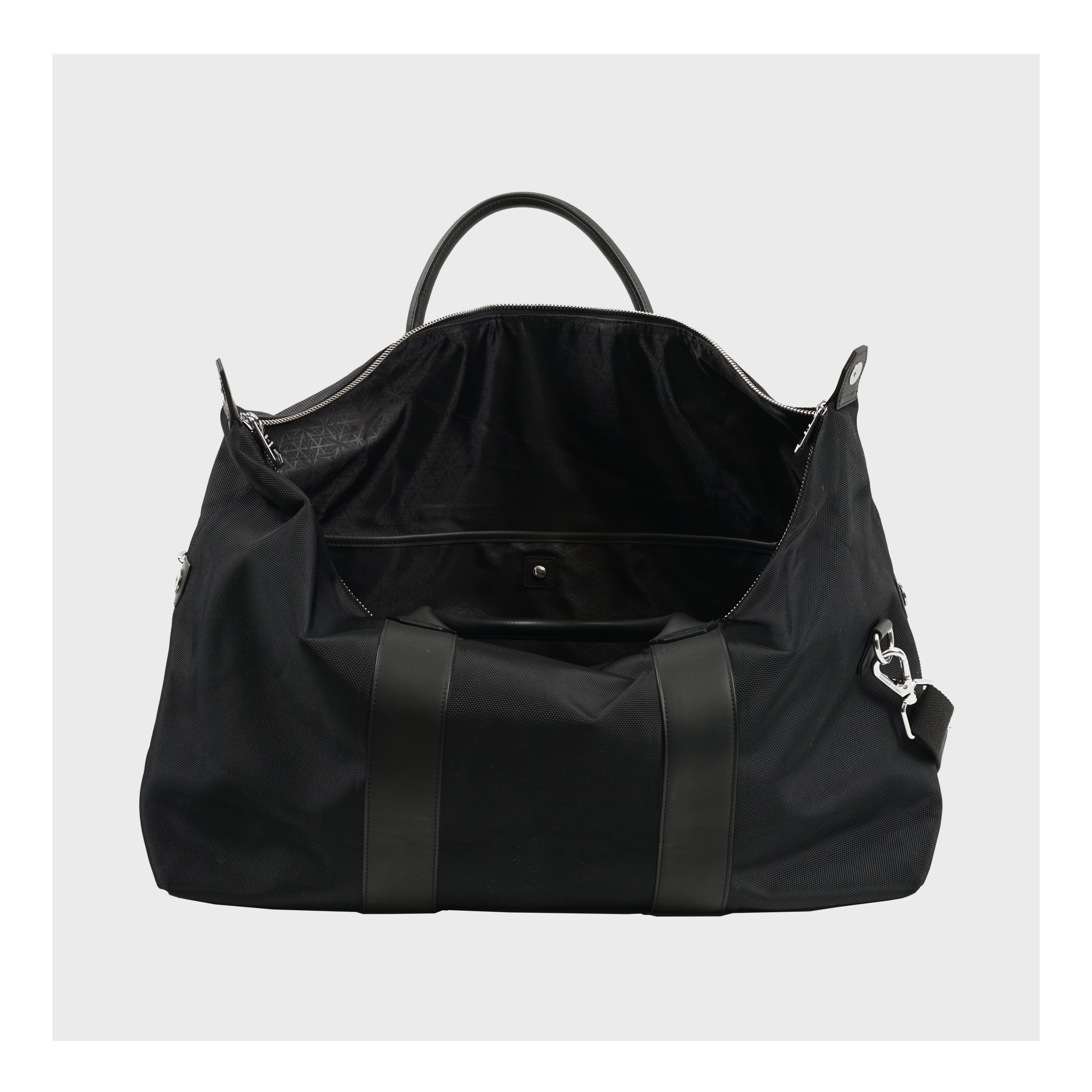 Top open view of the black Weekend Bag, highlighting the ample storage and quality lining